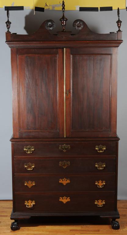 Mahogany Chippendale Style Linen Press: Early to mid 20th C., double door opens to four drawers, over four dovetailed drawers with brass pulls (some bale handles loose) on ball and claw feet.H: approx. 86".W: approx. 44".D: approx. 25 1/2".