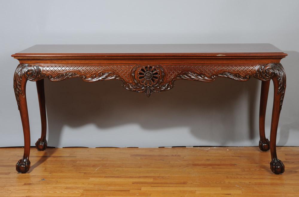 Mahogany Chippendale Style Low Table: Molded edge top, carved apron, cabriole legs and claw feet.H: approx. 28".L: approx. 64".D: approx. 25".
