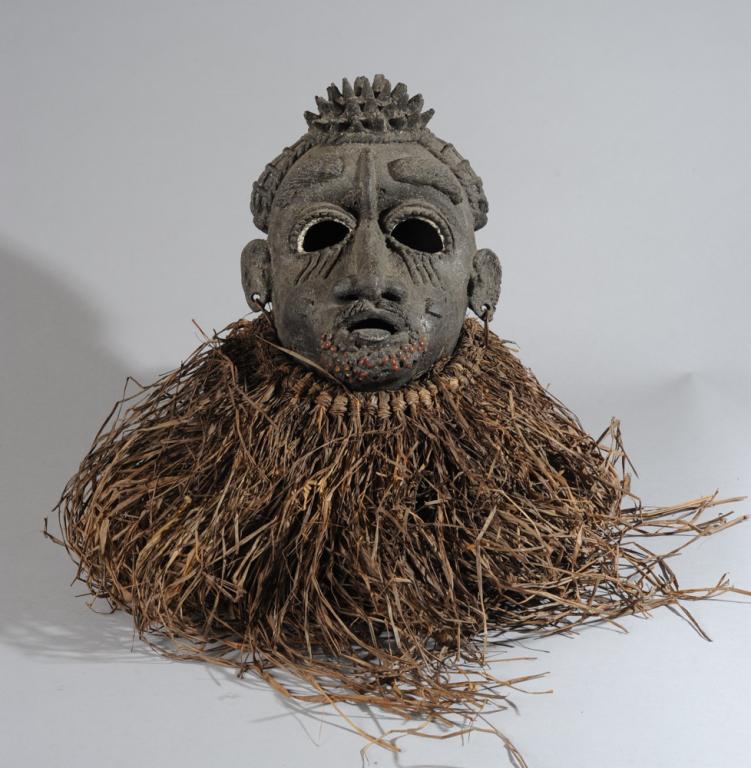 Bronze Mask Cameroon: Likely Bamileke or Bamum (also Bamoum, Bamun, Bamoun) bronze or other metal mask with tri-part, spiked coiffure, thick eyebrows and moustache, raised facial scarification, abras seed beard, with raffi