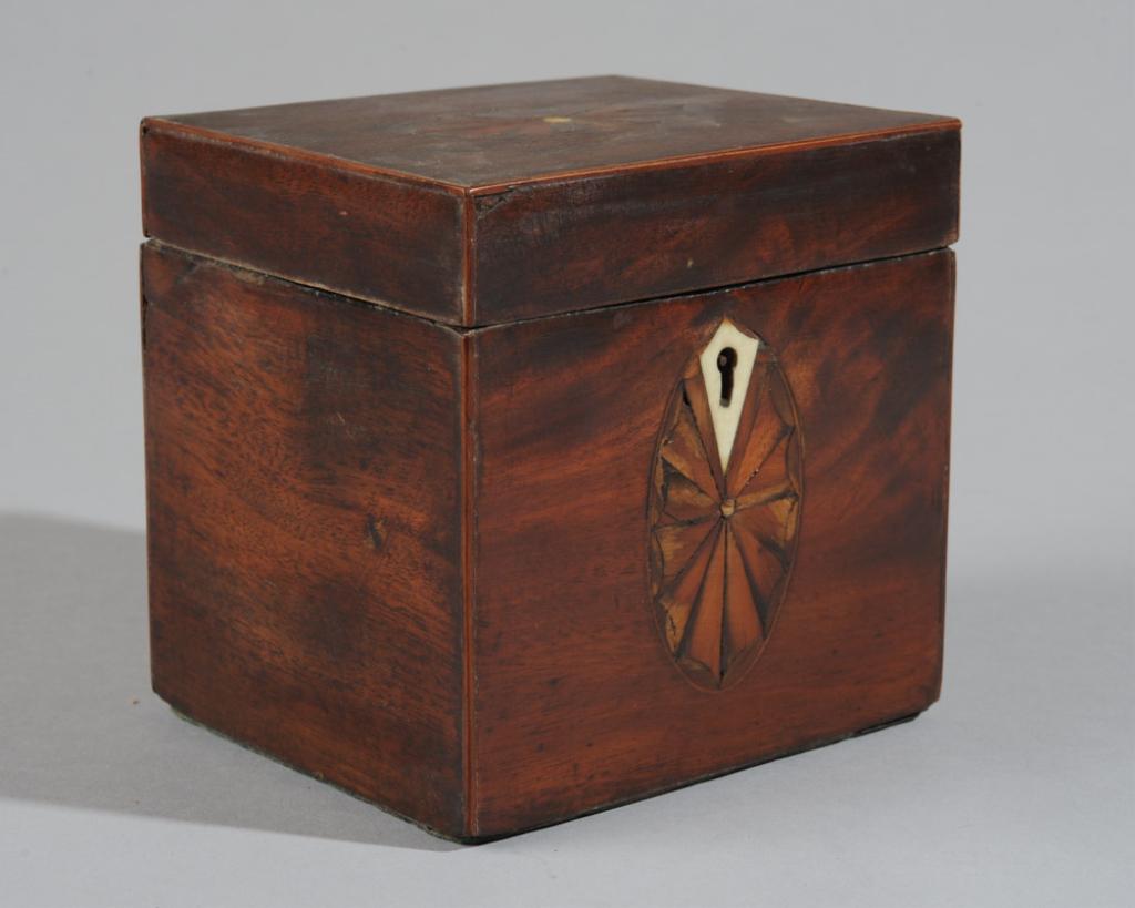 Antique English Inlaid Mahogany Tea Caddy: Diminutive late 18th century tea caddy with decorative inlay to top and front, bone escutcheon, some losses / in as-found condition.H: approx. 4 1/2".W: approx. 4 1/2".D: approx. 4".