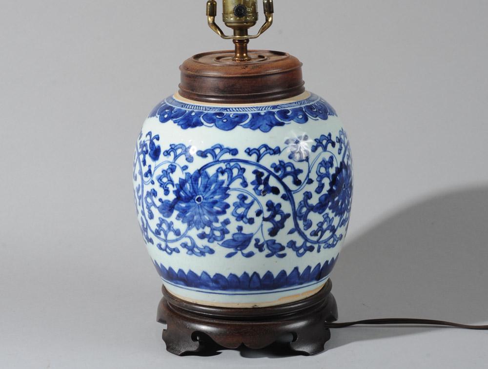 Antique Chinese Blue & White Jar: Mounted as lamp. With wide band of lotus scrolls and having ruyi border at neck, lappet border at base. Shaped wood base and wood cover. Harp with lapis ornament as finial. Jar alone approx. 8" H. Hei