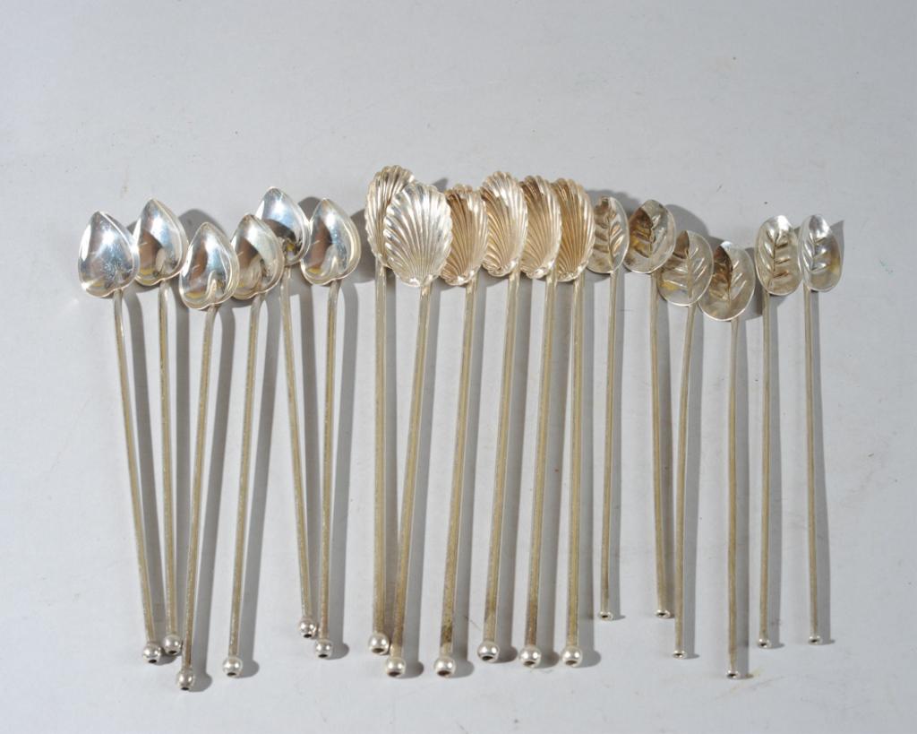 Eighteen Sterling Cocktail Spoons: Six with leaf motif marked C. Benedict Denmark, six with shell motif and no maker's mark, six with heart motif marked WER (probably William R. Elfers Co.), all marked sterling.Longest: approx. 8 1/4".