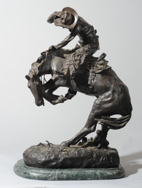 After Frederic Remington (1861 - 1909) Rattlesnake: Bronze sculpture after Frederic Remington (1861 - 1909), on green marble plinth, no foundry marks.H: approx. 23 1/2".