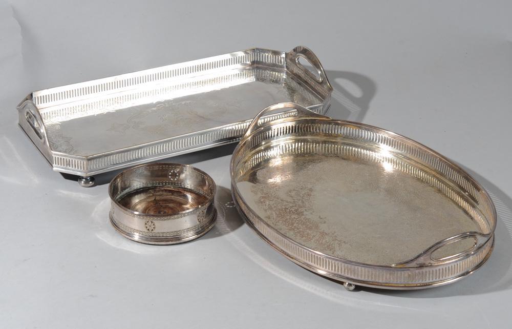 Mixed Silverplate Lot: Including two galleried footed trays one marked Sheffield and S. Co., and a silverplate wine coaster.Oval tray: approx. 15 1/2" x 11 1/4".