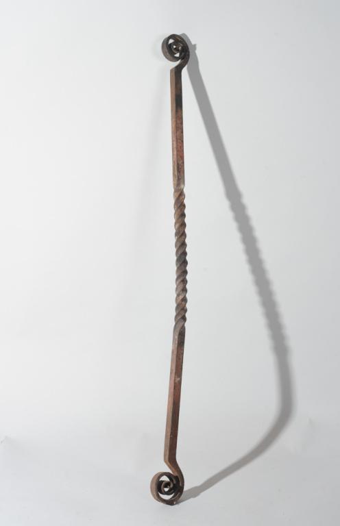 Antique Hand Forged Iron Hanging Rod: With curled ends, twists at center, original use uncertain but would make a handsome curtain or tapestry rod. Appears to be 19th C. or possibly earlier. Approx. 40" long.