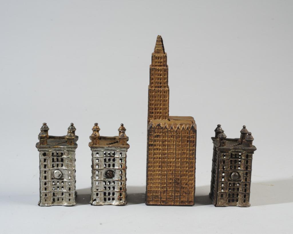 4 Early to Mid 20th C. Cast Iron Building Banks: No visible maker's marks (possibly A.C. Williams), some paint loss and rust / in as-found condition.Tallest H: approx. 7 3/4".