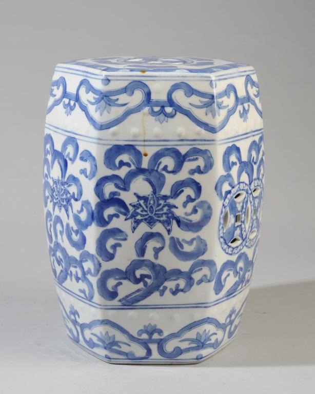 Small Chinese Blue & White Ceramic Garden Seat: Hexagonal drum seat, the top with auspicious bats surrounding an openwork coin, the sides with lotus scrolls, raised bosses. Approx. 12 1/2" H.