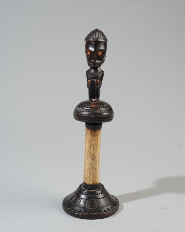 Indonesian Carved Bone & Wood Lime Container: The wooden lid carved with seated figure, the hollow bone with elaborate etched shamanic markings, with wide carved wood base. Ceremonial style lime container, possibly Batak artist, Sumatra. Approx. 