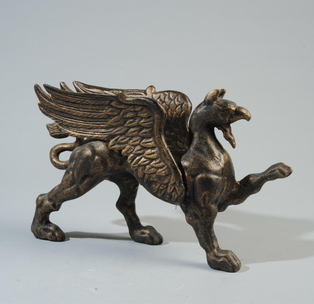 Cast Iron Griffin Doorstop: Contemporary. With bronze finish. Approx. 9" H x 13 3/4" L x 4" W.