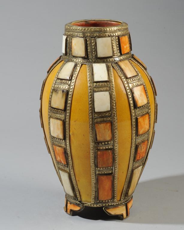 Moroccan Inlaid Pottery Vase: Footed pottery vase with saffron gold glaze, with decorative nickel cladding inlaid with squares of dyed camel bone. Approx. 12" H.