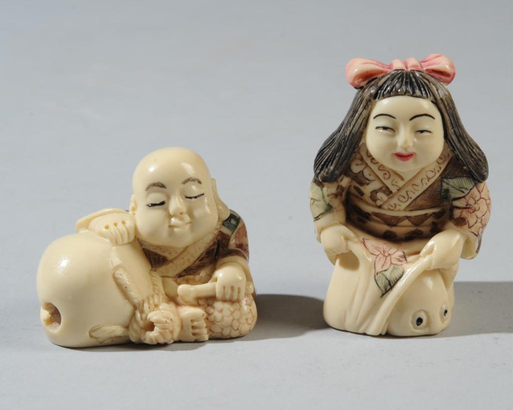 Two Figural Netsuke, Signed: An Immortal dozing by a large sack, and a girl uncovering someone who is hiding. Girl approx. 2" H.