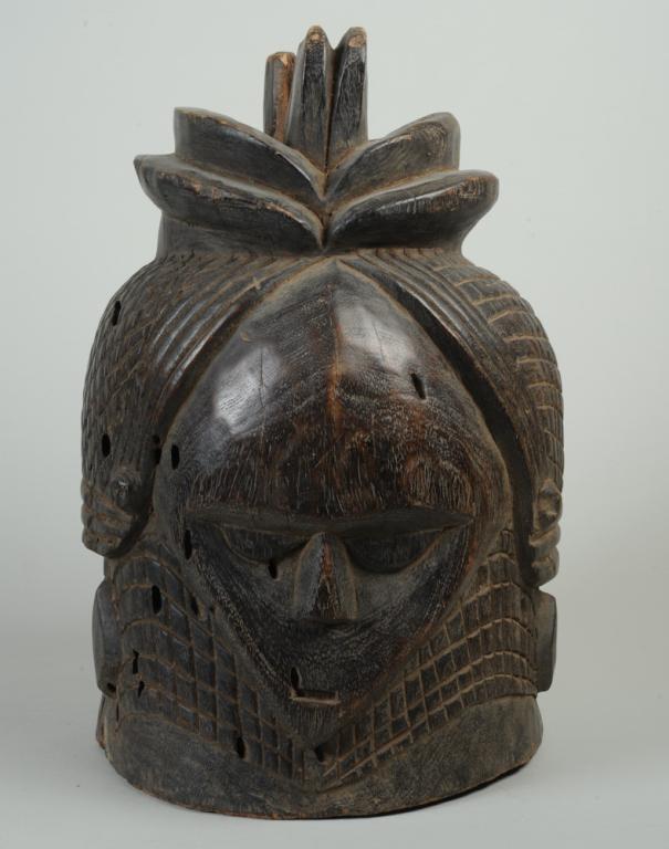 Vai Sande Society Helmet Mask: As used in female initiation ceremonies. Liberia or Sierra Leone. Approx. 17" in height, 11 1/4" diameter. Provenance: Estate of Thomas McNemar, (1931-2020.) McNemar lived and collected throughout Cen