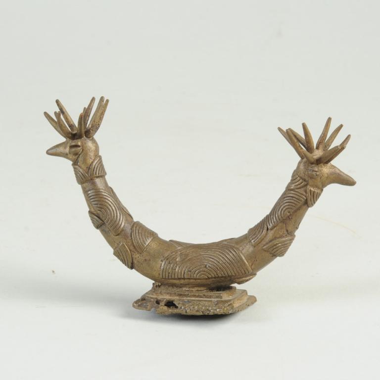 Akan / Ashanti Gold Weight or Ornament: Bronze bird with two exuberantly feathered heads. Approx. 5 1/2" L. Provenance: Estate of Thomas McNemar, (1931-2020.) McNemar lived and collected throughout Central and West Africa in the 1960s and 7