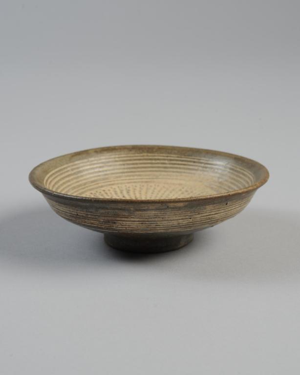 Korean Joseon Dynasty Buncheong Plate: Small 16th C. saucer dish with stamped and incised decoration highlighted with white slip. Approx. 4 3/8" diameter. Provenance: Estate of Cayce Odom of Charlottesville, VA.