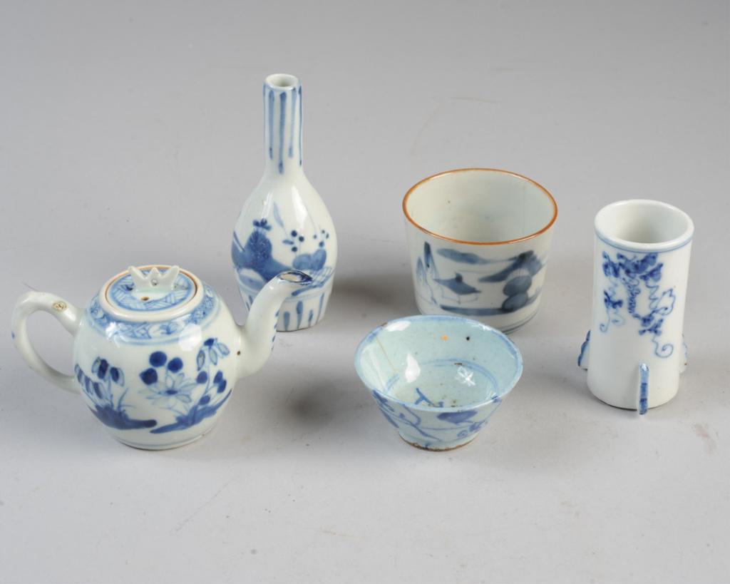 Antique Chinese & Japanese Blue & White Lot: Blue & white porcelain lot including small teapot, Chinese wine cup, Japanese soba cup, a small bottle vase and a small vase with grape vine pattern. Bottle vase, approx. 5" H. Provenance: Estate of C