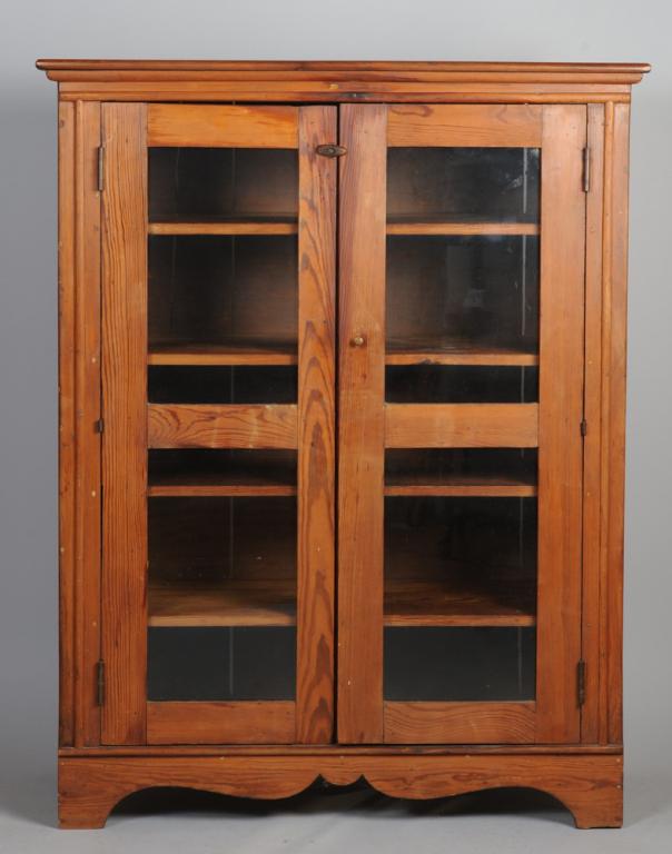 Glass Front Cabinet: With molded edge top over double glass front doors, shaped skirt, bracket feet.H: approx. 52 1/2".W: approx. 41 1/2".D: approx. 15".