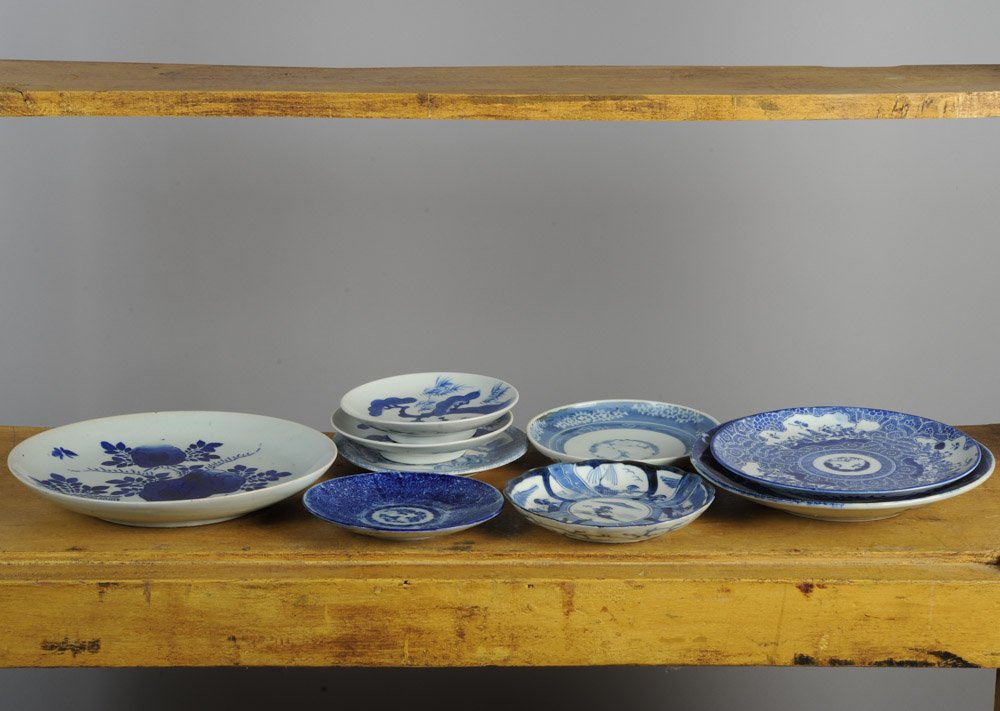 Mixed Lot Japanese Arita Edo & Meiji Porcelain: To includ: an 11 1/8" diameter ko-sometsuke charger with bold cobalt stenciled design and six kiln spurs to verso; an early 7 1/4" plate with 'Three Friends of Winter' motif and three large kiln spurs