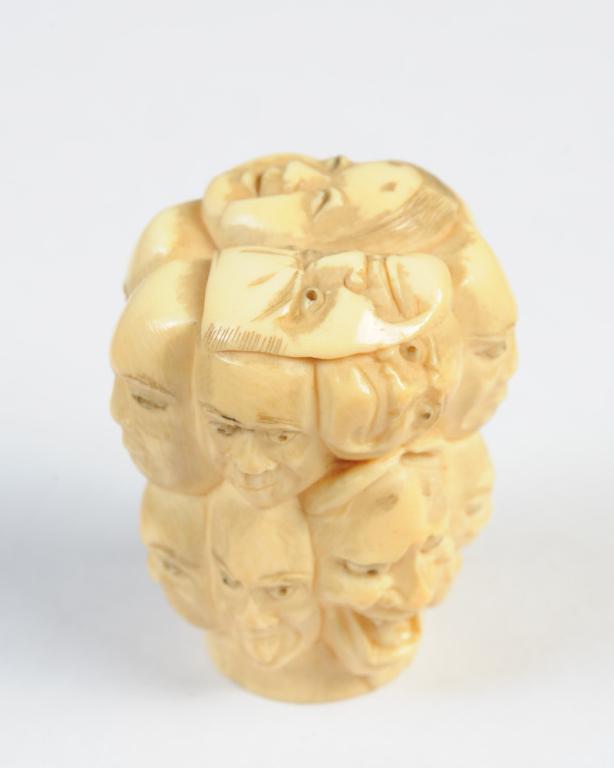 Japanese Noh Masks Okimono: With sixteen carved mask faces. Approx. 1 3/4" H. Provenance: Estate of Cayce Odom of Charlottesville, VA.