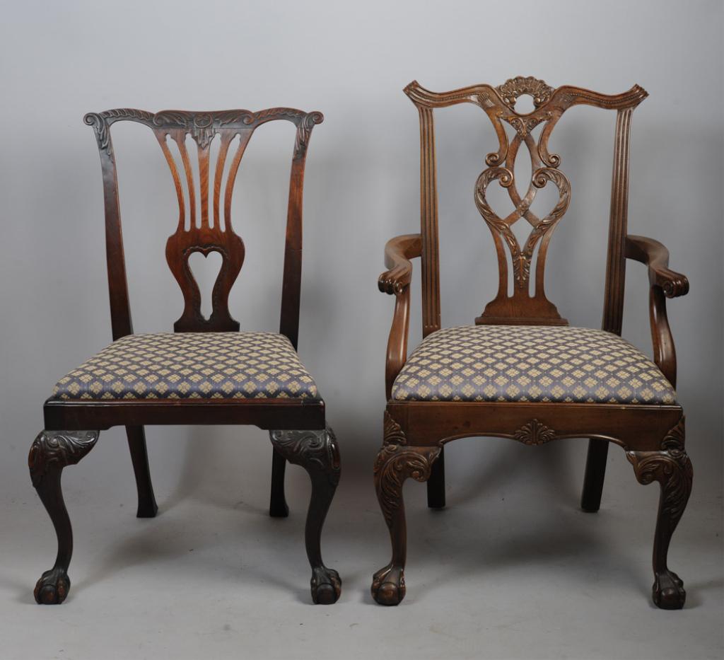 Chippendale Style Armchair and Side Chair: Both with upholstered slip seats, shaped crest rails, pierced splats, cabriole legs, ball and claw feet.Tallest H: approx. 38 1/2".