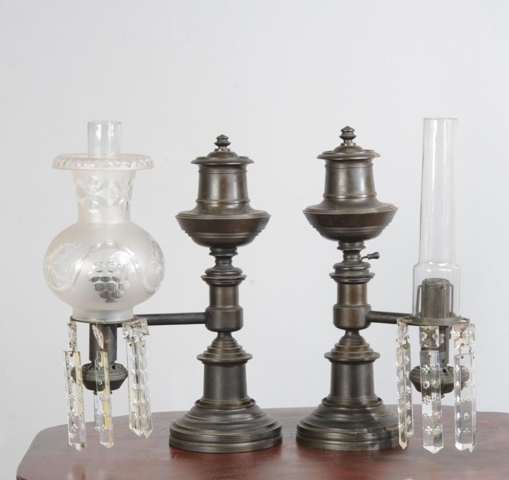 Pair H.N. Hooper Bronze Argand Whale Oil Lamps: Mid 19th century, manufactured by Henry N. Hooper & Co. (Boston), with glass globes and chimneys (one globe damaged, two chimneys with minor chips to base.)H: approx. 14 1/4".