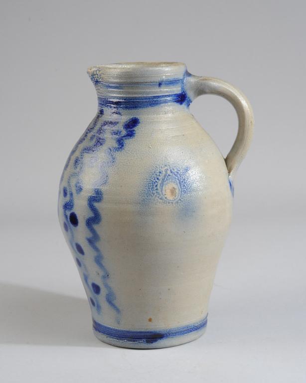 Cobalt Blue Decorated Stoneware Jug: No visible maker's marks, small chip to spout, in as-found condition.H: approx. 11".