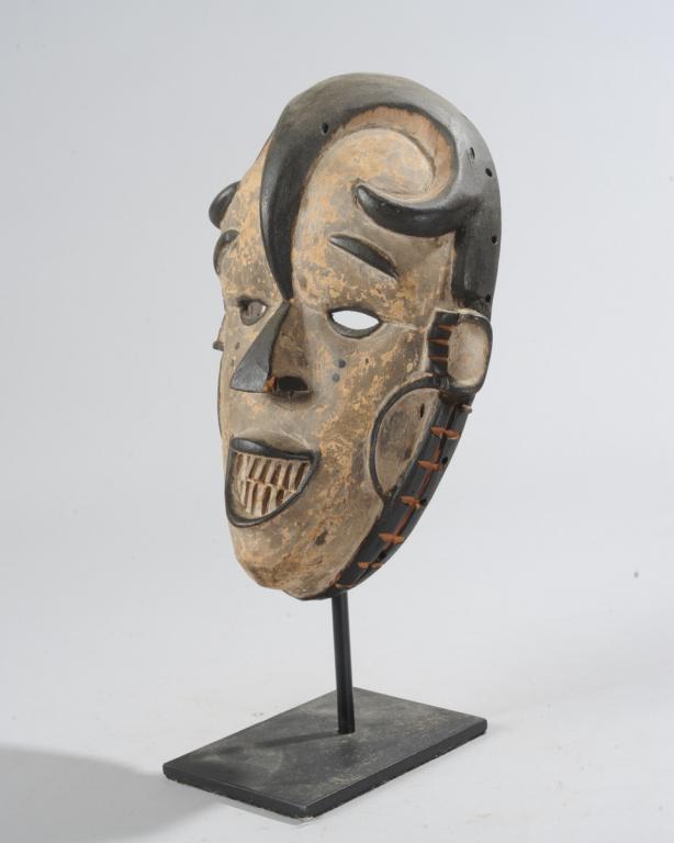 Igbo Okorishi Mask: "Water Spirit" mask, Igbo people, Nigeria. On custom gallery stand. Mask approx. 10" x 6 1/2" x 4". Provenance: Estate of Thomas McNemar, (1931-2020.) McNemar lived and collected throughout Central an