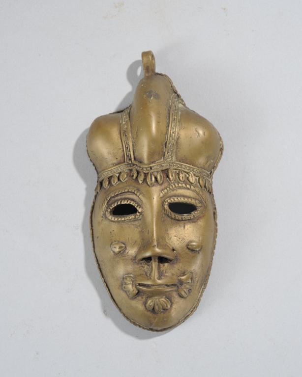 Small Bronze African Mask: Approx. 5 1/2" x 2 3/4" x 1 1/2". Provenance: Estate of Thomas McNemar, (1931-2020.) McNemar lived and collected throughout Central and West Africa in the 1960s and 70s. He established galleries of Af
