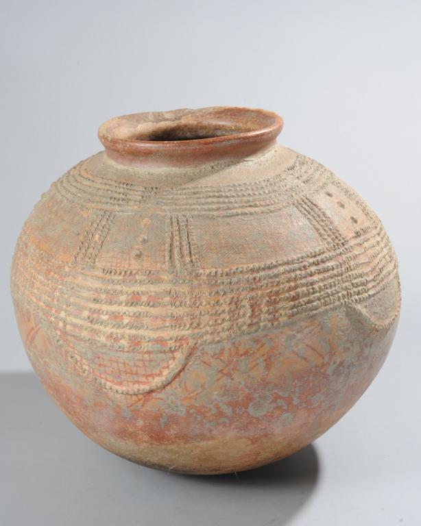 Dogon Terracotta Beer Pot, Mali: Round terracotta pot for making beer, with impressed textile, low relief and natural pigment painted decoration, small rolled rim. Old repair at rim. Pot, approx. 16 " H, 16" D. Provenance: Estate of 