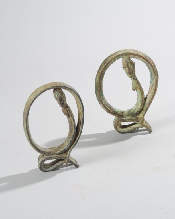 Two Dogon Bronze Figures: Two small female hoop figures, approx. 5 1/2" H and 5" H. Provenance: Estate of Thomas McNemar, (1931-2020.) McNemar lived and collected throughout Central and West Africa in the 1960s and 70s. He est