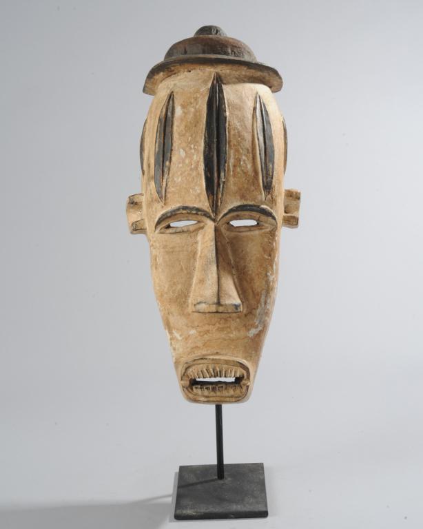 Fang Mask, Gabon: On custom gallery stand. Approx. 18" H. x 8" W x 4 1/2" D. Provenance: Estate of Thomas McNemar, (1931-2020.) McNemar lived and collected throughout Central and West Africa in the 1960s and 70s. He es