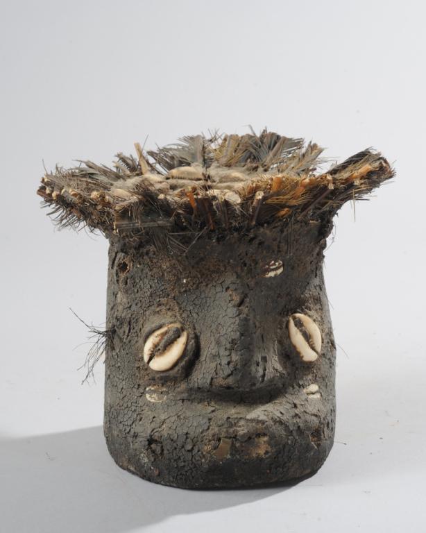 Tribal African Fetish / Shrine Object: Feathers, cowries, mud, and other organic materials, heavily encrusted. Possibly Fon? Approx. 6" H x 7" D. Provenance: Estate of Thomas McNemar, (1931-2020) McNemar lived and collected throughout Cent
