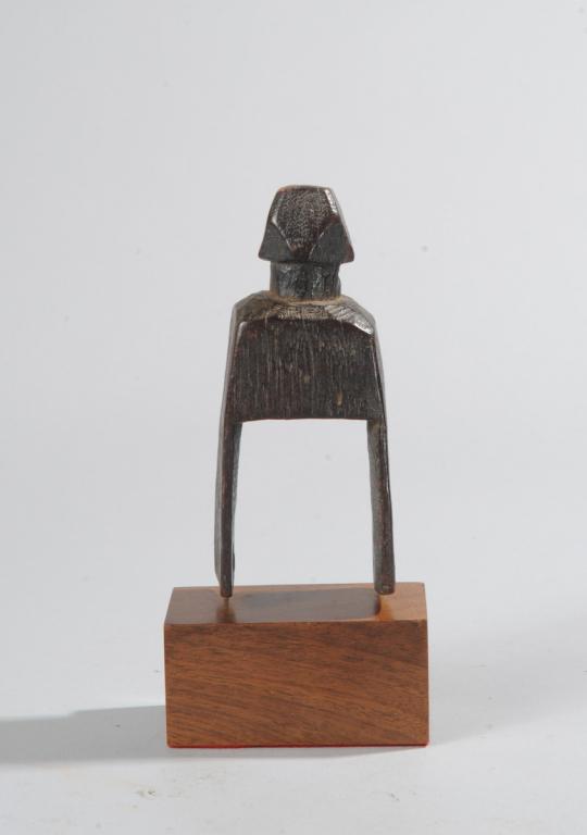 Dogon Heddle Pulley, Mali: Of abstract form, with facetted knob finial. Shows age and wear. On custom gallery stand. Total height approx. 7 1/4" H. Provenance: Estate of Thomas McNemar, (1931-2020.) McNemar lived and collected