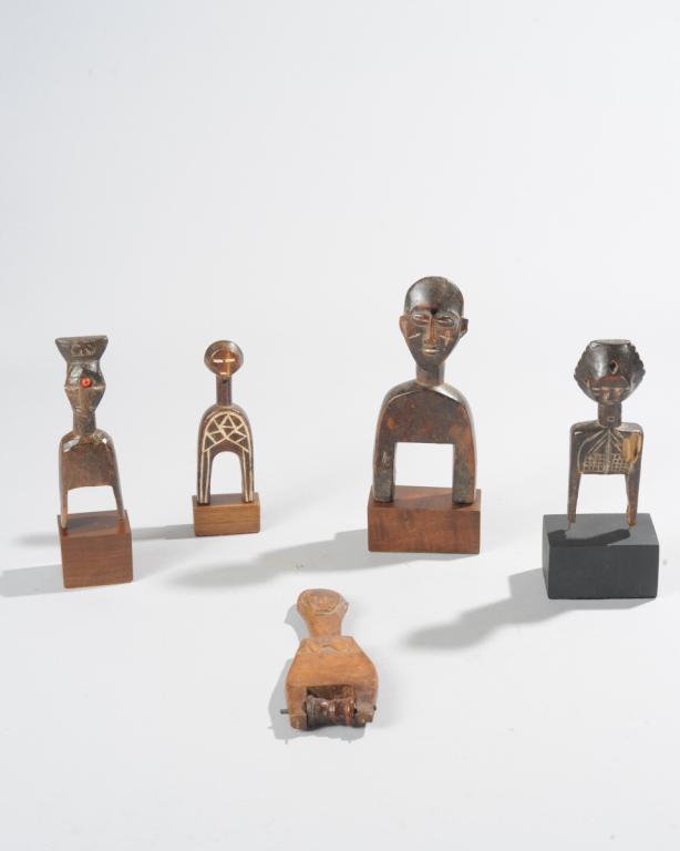 Five West African Heddle Pulleys: All of anthropomorphic form, all but one on custom gallery bases. Tallest, including base, approx. 8 1/4" H. Provenance: Estate of Thomas McNemar, (1931-2020.) McNemar lived and collected throughout C
