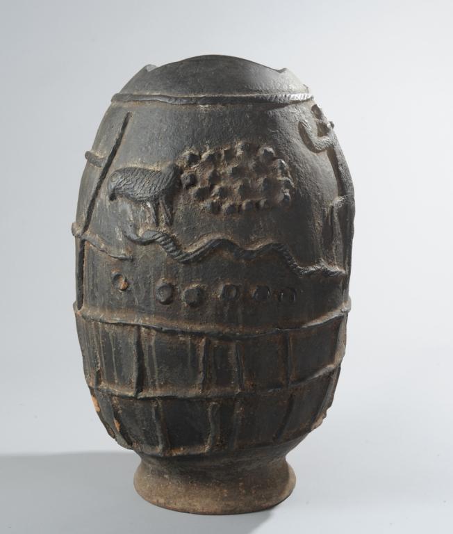 Gurunsi ? Pottery Vessel: Black terracotta ovoid vessel with relief figures of crocodile, bird, and buffalo, and snake. Flattened base. Approx. 20 1/2" H. Provenance: Estate of Thomas McNemar, (1931-2020.) McNemar lived and co