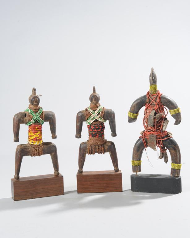 Three Namji Fertility Dolls: Carved wood with beads, shells. Cameroon. Mounted to gallery stands. Tallest approx. 15 1/2" H.Provenance: Estate of Thomas McNemar, (1931-2020.) McNemar lived and collected throughout Central and Wes