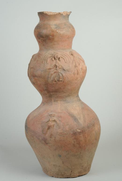 Fra Fra / Fare Fare / Gurunsi Pot: Triple gourd form pot with compelling relief and incised figures of people, a snake, spirals, and fanning lines. Losses at rim. Fra Fra (Fare Fare) subgroup, Gurunsi people, Northern Ghana. Old repair
