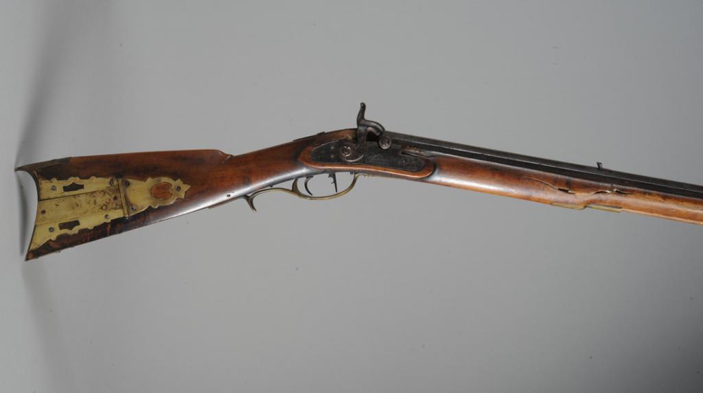 Shenandoah Valley, Va. Flintlock Rifle: Flintlock rifle converted to percussion. Extra heavy barrel. Brass patch box with early repair. Barrel engraved U. F. for Uriah Fisher. Born in 1802, Fisher was active as gunsmith c1825-1850 in Shenan