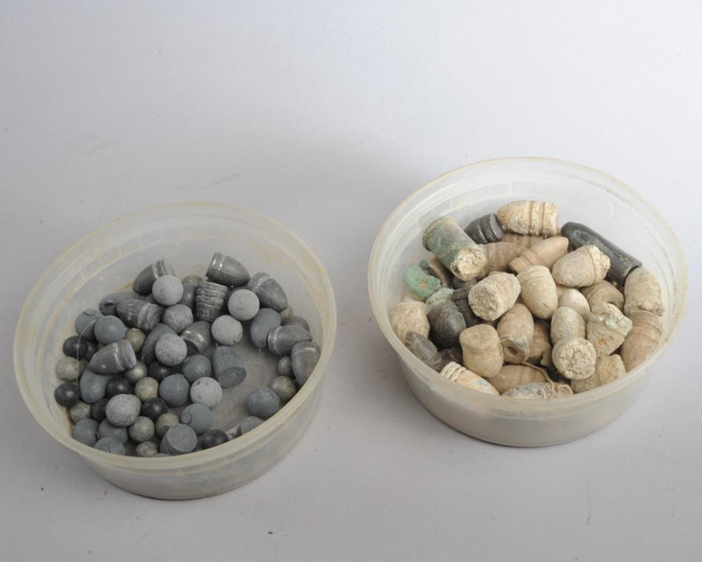 Lot Civil War Bullets, Fragments, Balls etc.: Mixed lot Civil War bullets, one with handwritten tag reading: "Minie Ball Authentic .58 caliber lead bullet from the Vicksburg Campaign in 1863--the most commonly used bullet used in the Civil War."