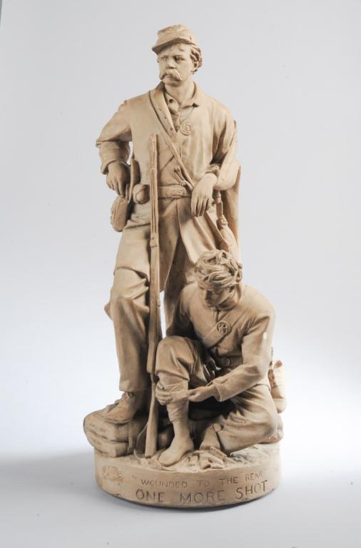John Rogers Civil War Group: Wounded to the Rear: Painted plaster figural group by American artist John Rogers (1829-1904) showing two Civil War soldiers, one wounded, one reaching for ammunition. Base with title"Wounded to the rear. One more shot", 