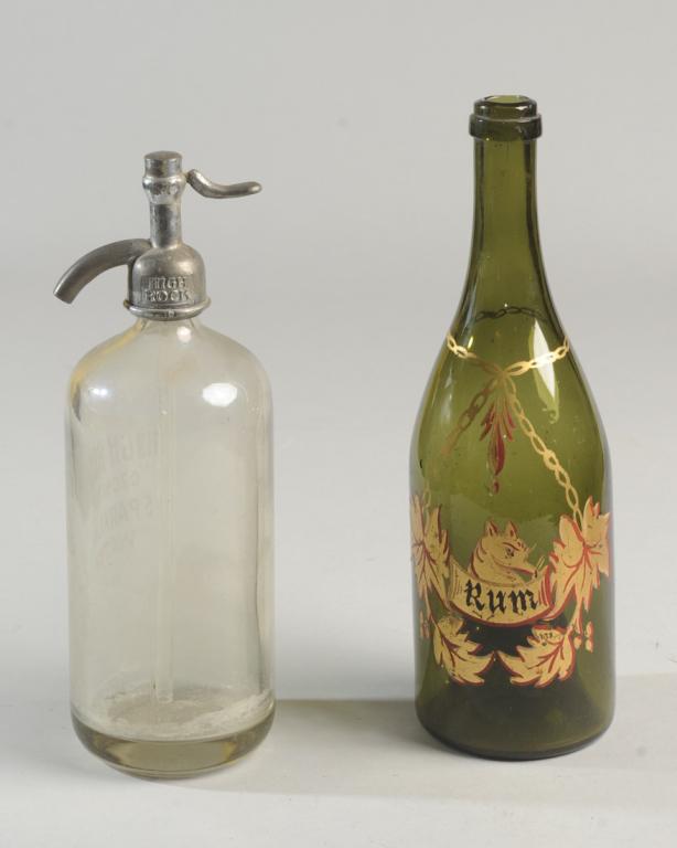Antique & Vintage Liquor, Seltzer Bottles: To include a 19th C. free blown green glass bottle with high inverted punt, likely French, with gilt and red painted decoration and "Rum" label. Offered together with an antique or vintage High Rock I