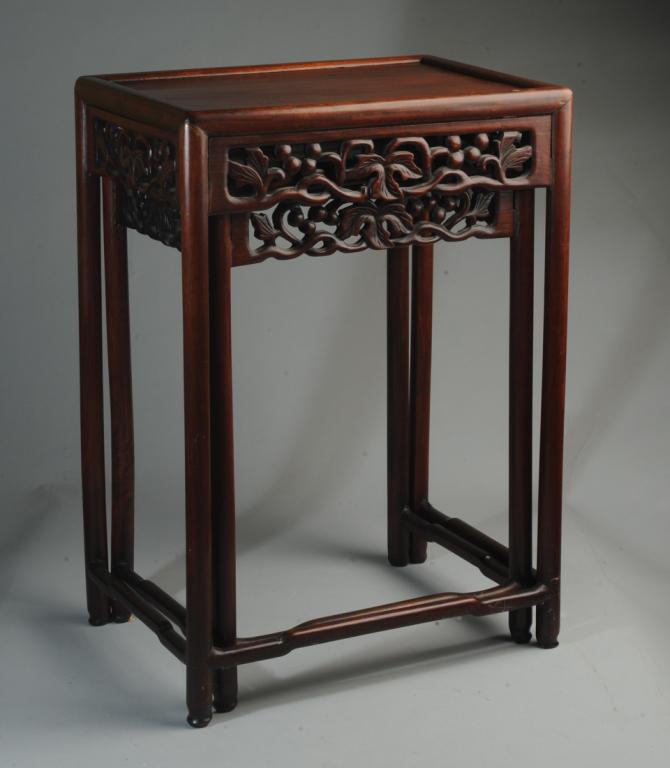 Chinese Nesting Tables: Two rosewood nesting tables with carved openwork aprons showing grapevines with fruit and leaves. Gently curved stretchers. Larger table, approx. 18" x 13" x 26" H. #1348779-134#1348779-106