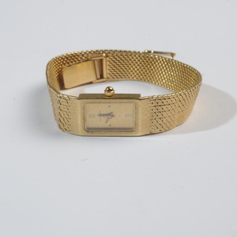 Bucherer 18K Yellow Gold Ladies Watch: Face with: "Bucherer' and 'Swiss'. Case marked 18K, mesh bracelet marked 750, (Italian 18K mark.) Approx. 7 3/4" total length. Will fit up to 7 1/4" wrist. 36 grams total weight.