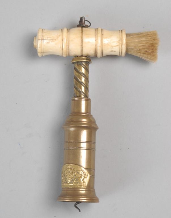 Antique British Corkscrew w/ Bottle Brush: Bone handle brush and brass corkscrew wine bottle opener with brass plaque with repousse British Royal coat of arms. Approx. 6"x 4" x 1 1/4".