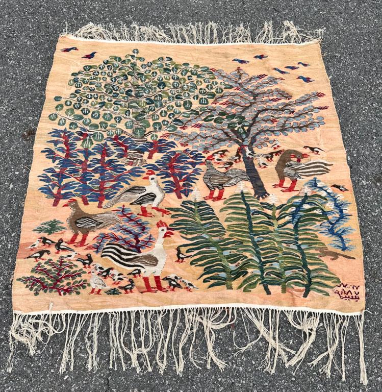 Ramses Wissa Wassef School Egyptian Weaving 1988: Graceful and light hearted wool on cotton weaving showing birds amidst foliage and trees in greens, blues, reds and white on a variegated peach ground. The weaver, identified on the accompanying card