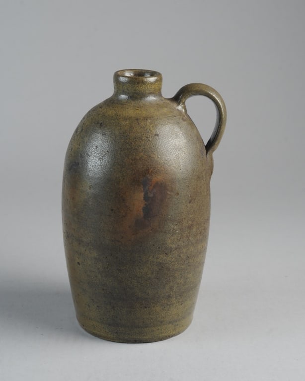 Strasburg Va. Stoneware Jug George W. Miller: Salt-glazed stoneware jug stamped GEO. W. MILLER, STRASBURG VA. (Mark partially illegible.) Very good condition, no chips or cracks. Approx. 10" H.