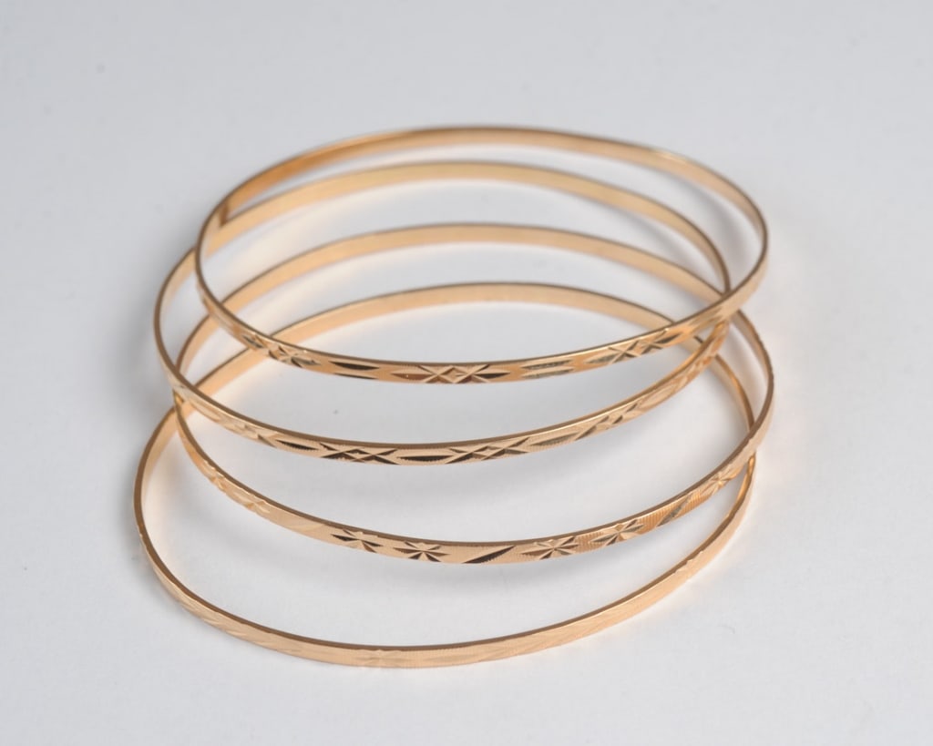 Four Yellow Gold Bangle Bracelets (1 of 2)