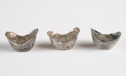 Three Chinese Silver Ingots: Three boat-shaped silver ingots or sycees, two with impressed marks, likely auspicious, meaning 'Life". One unmarked but tests silver. Total weight approx. 109.4 grams / 3.51 ozt.