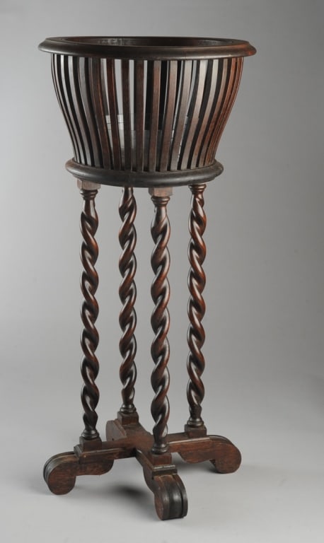 Antique Oak & Mahogany Barley Twist Jardiniere Stand: Handsome dark oak & mahogany jardiniere stand with four barley twist legs, slatted round pot container, crossed scroll feet. Approx. 32" H, 15" D.