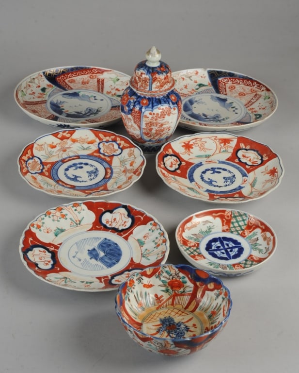 Mixed Lot Antique Imari Porcelain: To include a meiji vase and cover with lobed sides, decorated with birds and flowers and auspicious bats in underglaze blue with red and gold enamel. Extensive early repair with repainting to lid. Lot