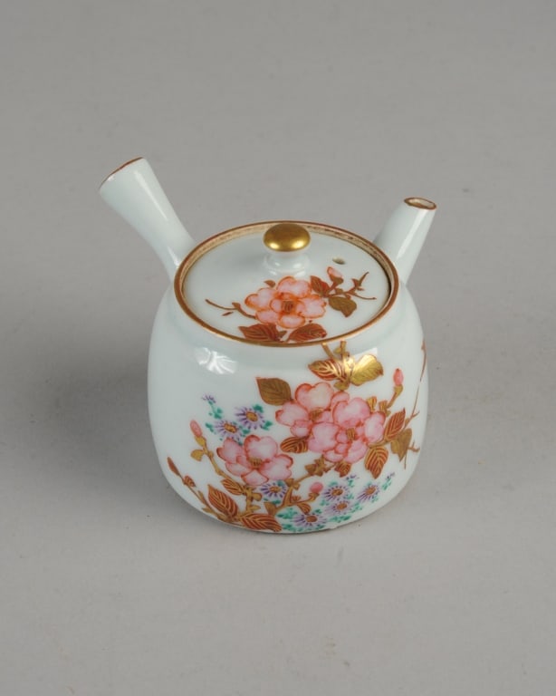 Meiji / Taisho Kyusu Teapot: Single serving porcelain kyusu with hand painted pink flowers. Six-character 'dai Nippon' mark under lid in underglaze blue. Unglazed base. Approx. 3 1/4"H.